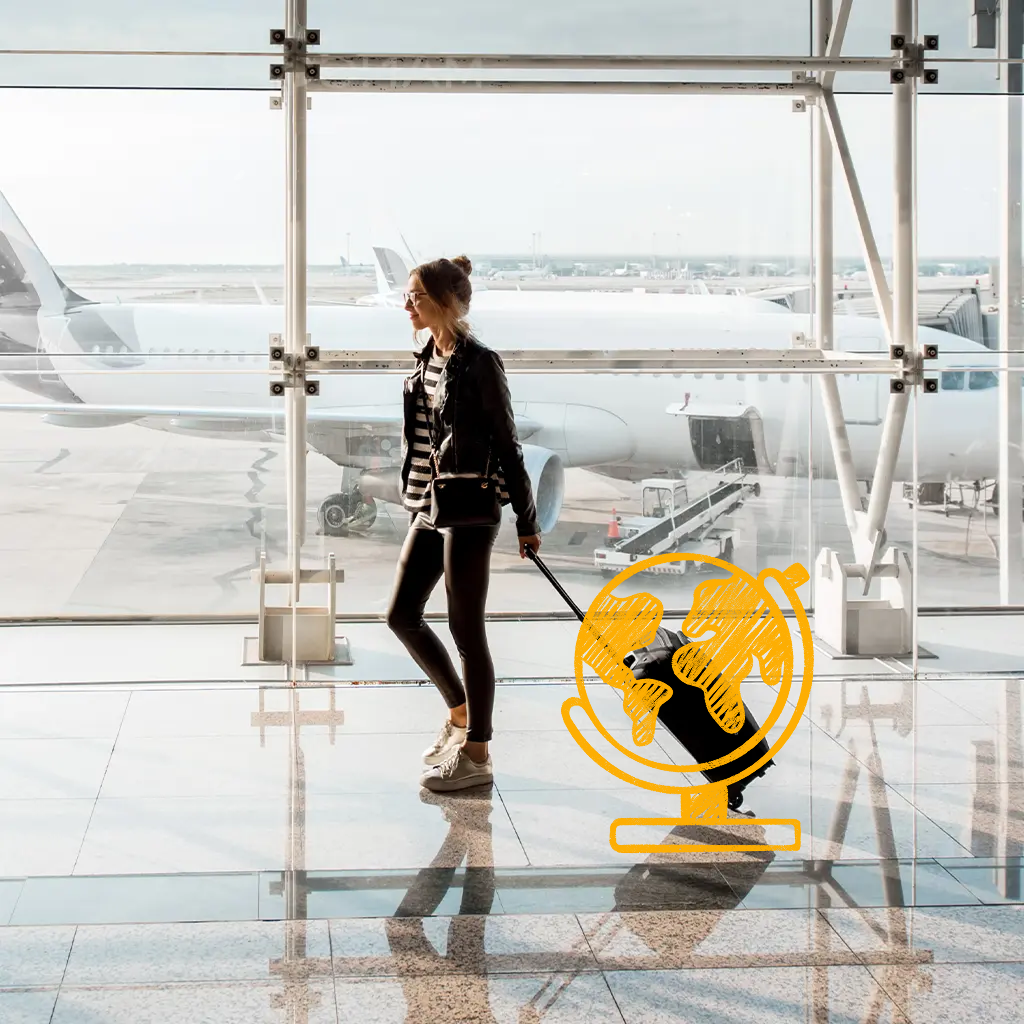 Inimene udustatud näoga hoiab nutitelefoni, istudes laua taga, millel on kollaste lillede vaas; taustal on köögikapid